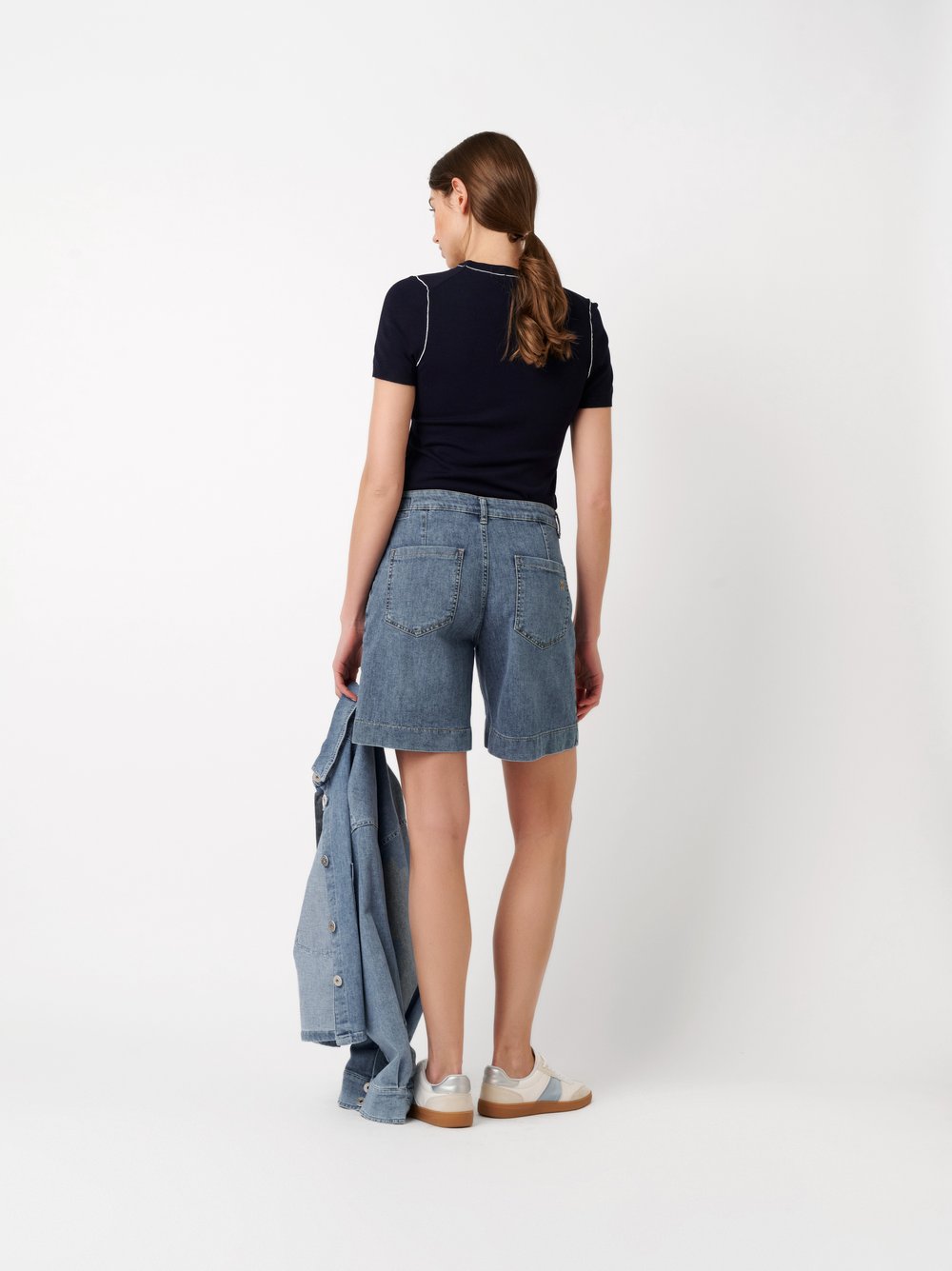 Womens shorts Mara Shorts in mid blue, denim shorts with framed pockets, back view worn by model