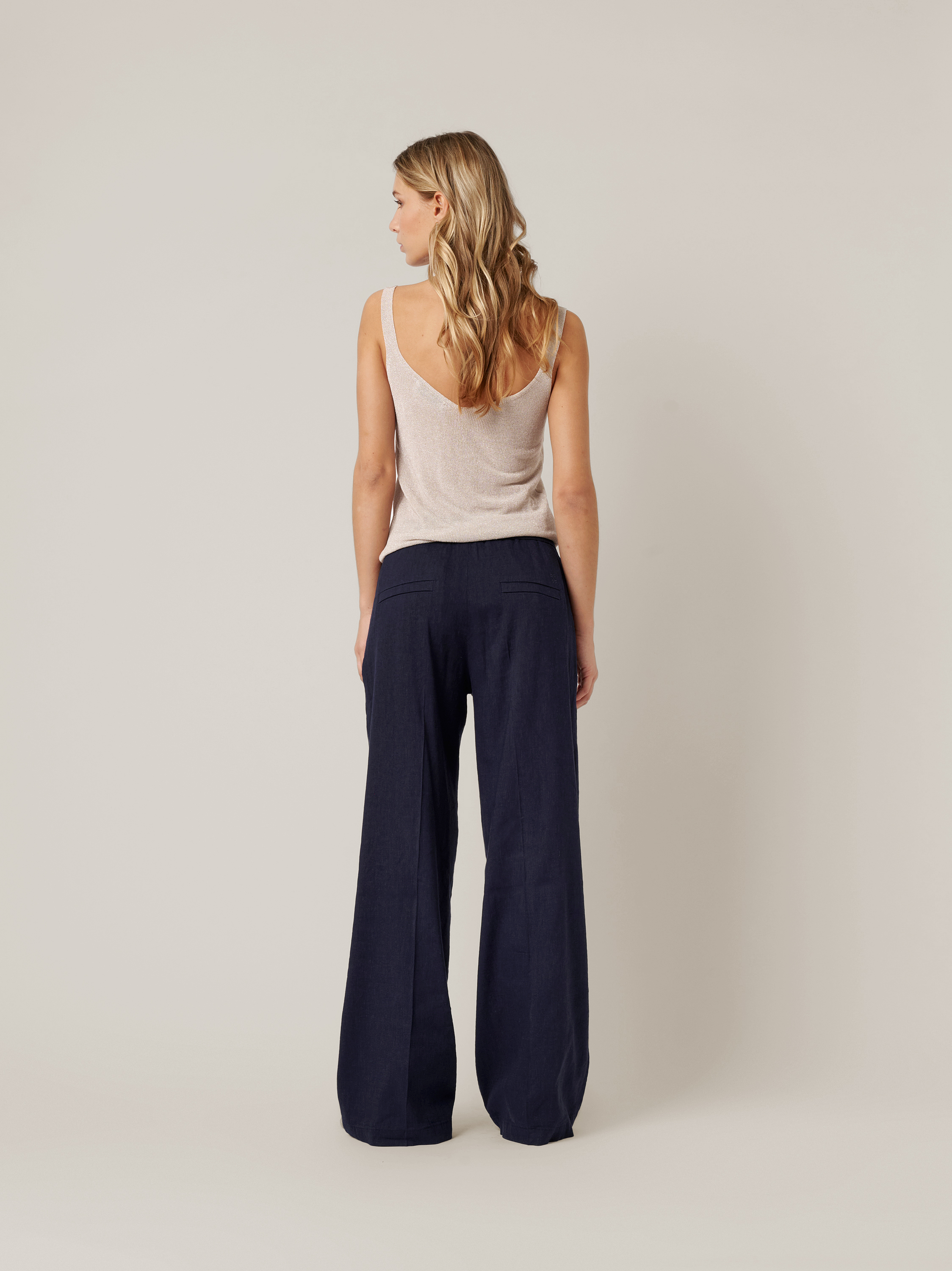 Womens trousers Mara Wide in navy, wide-leg linen trousers, back view worn by model