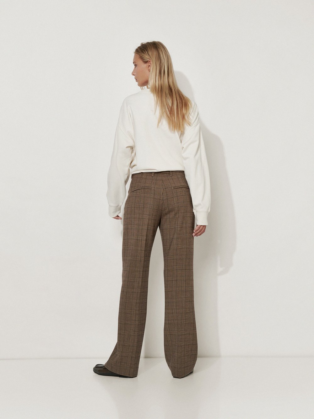 Womens trousers Audrey Flared in Navy, flared trousers in glen check, back view worn by model