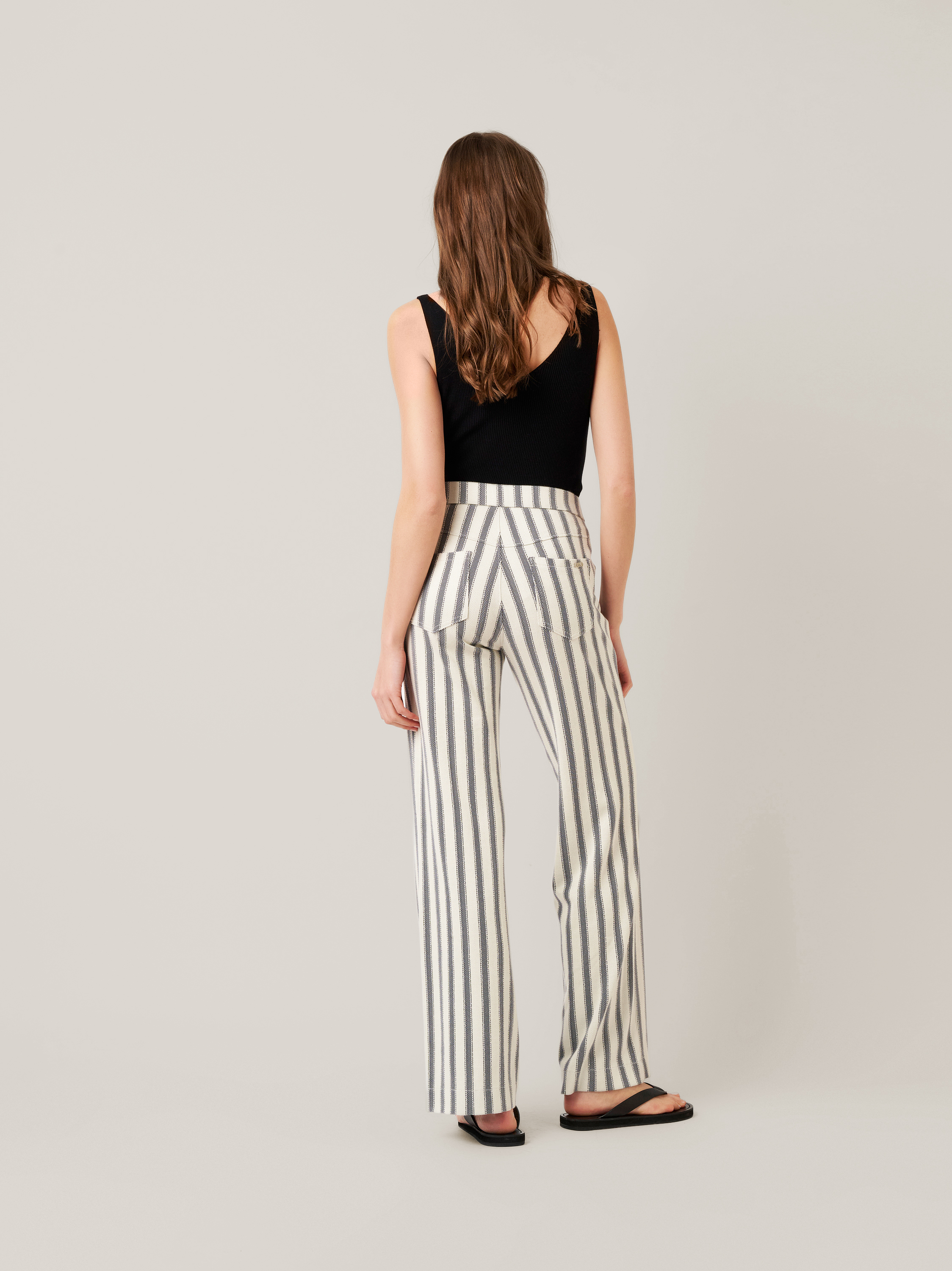 Womens trousers Audrey Sailor in navy / offwhite, striped bootcut trousers with sailor front, back view worn by model
