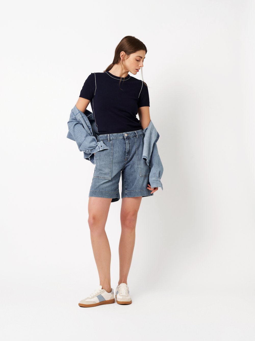 Womens shorts Mara Shorts in mid blue, denim shorts with framed pockets, front view worn by model