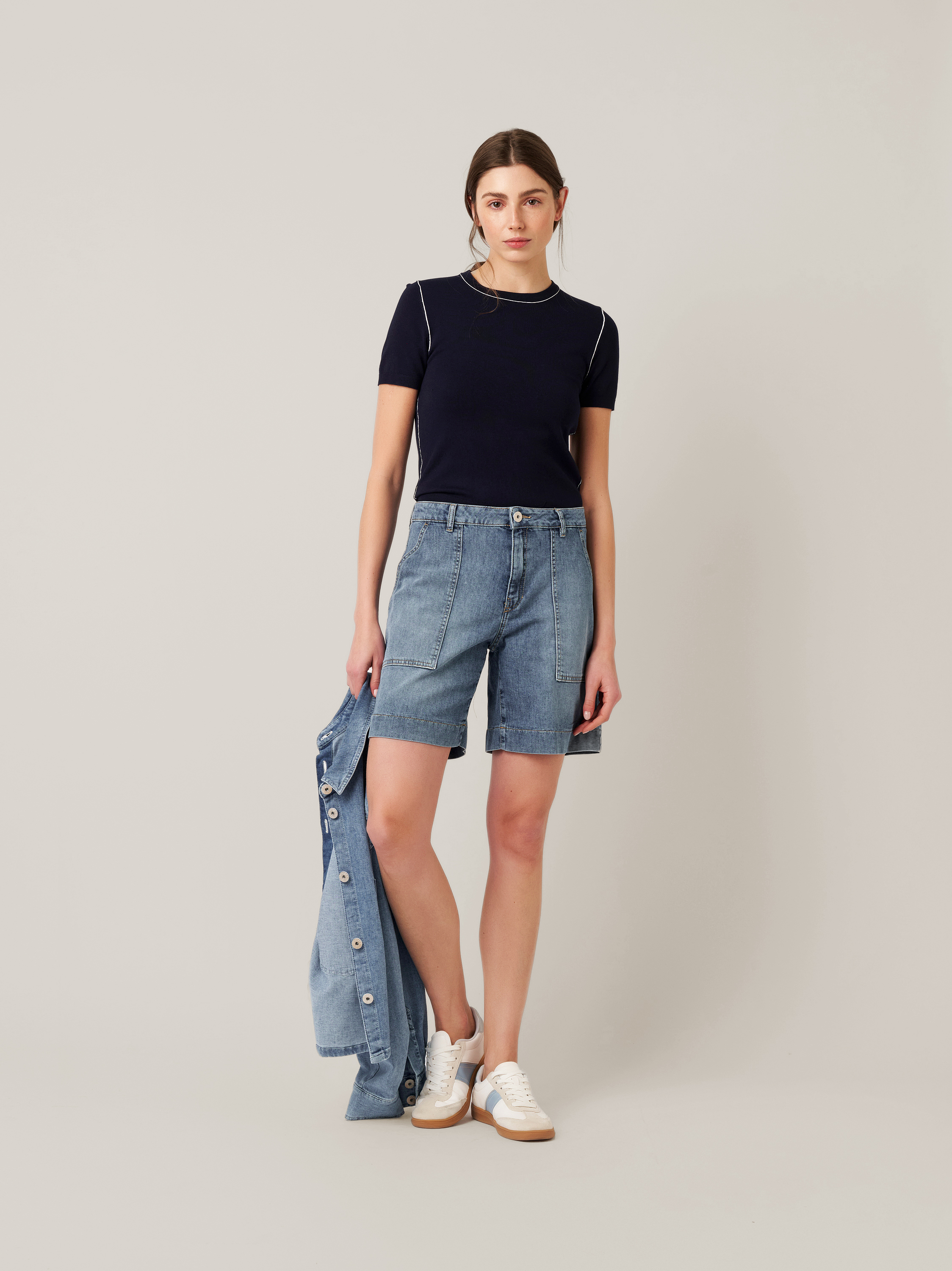 Womens shorts Mara Shorts in mid blue, denim shorts with framed pockets, outfit view worn by model
