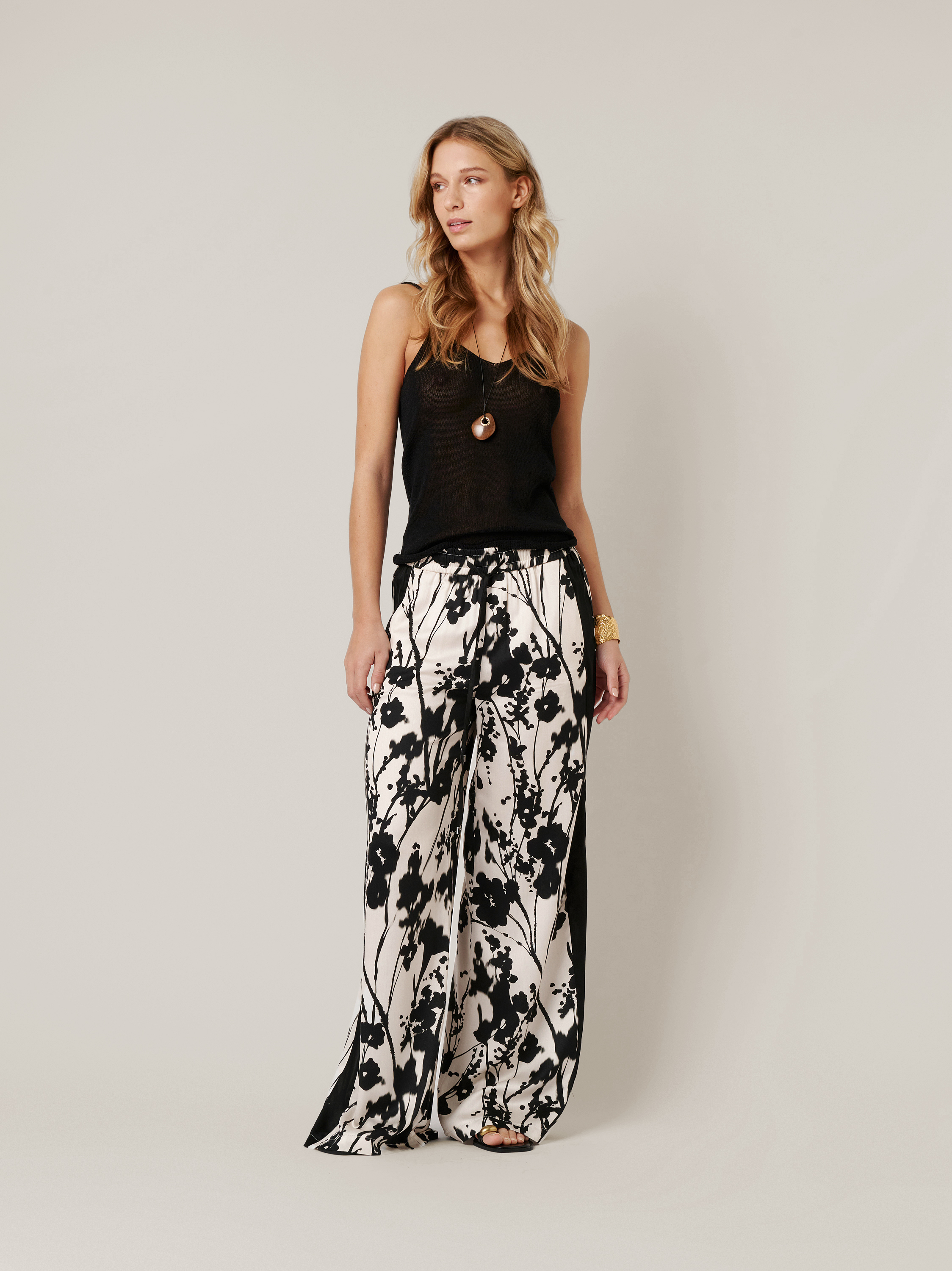 Womens trousers Mara Palazzo in black / offwhite, palazzo pants with flower print, outfit view worn by model