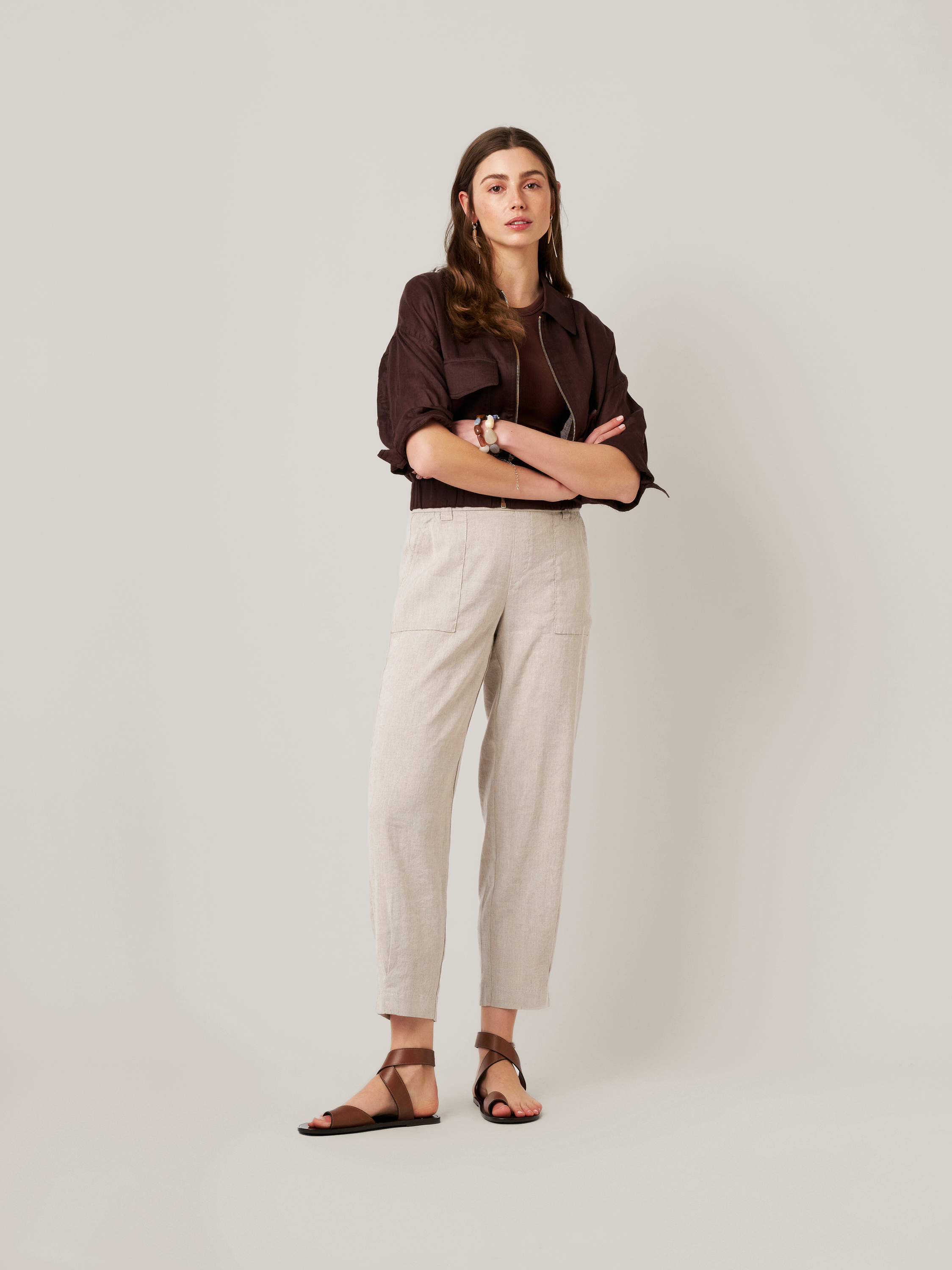 Womens trousers Mara Tapered in grey, tapered-fit trousers made of linen, front view worn by model