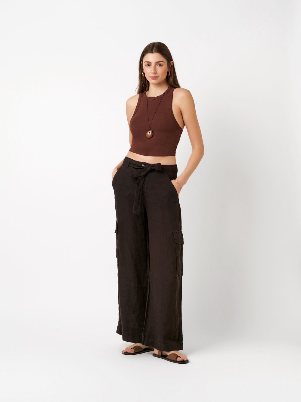 Womens trousers Mara Wide in dark brown, wide-leg linen trousers with cargo pockets and tie, front view worn by model