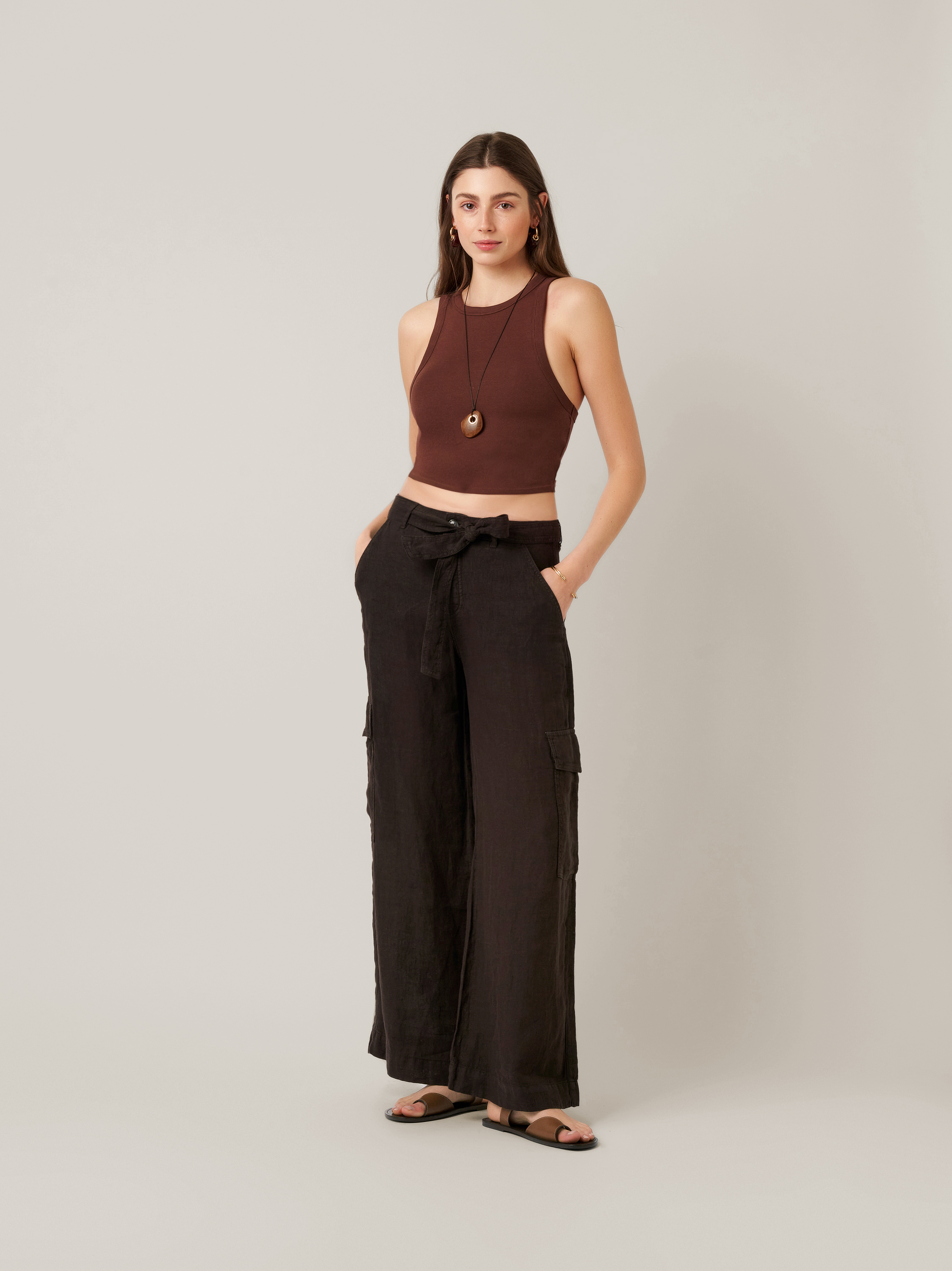 Womens trousers Mara Wide in dark brown, wide-leg linen trousers with cargo pockets and tie, front view worn by model