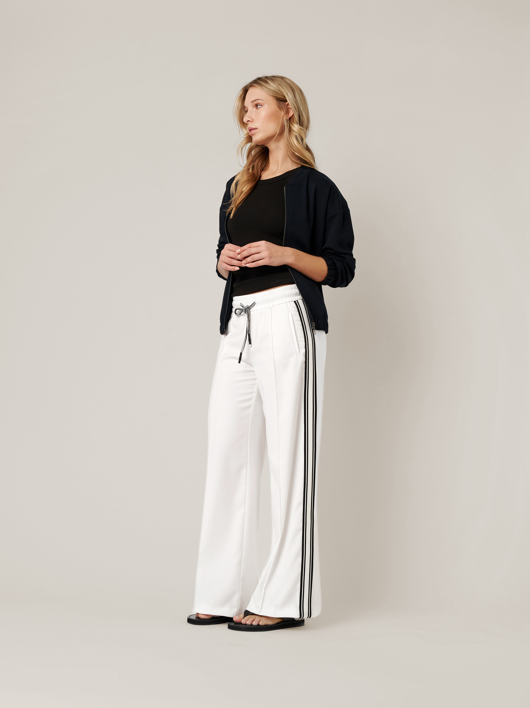 Womens trousers May Wide in white, wide-leg trousers with side stripes, outfit view worn by model