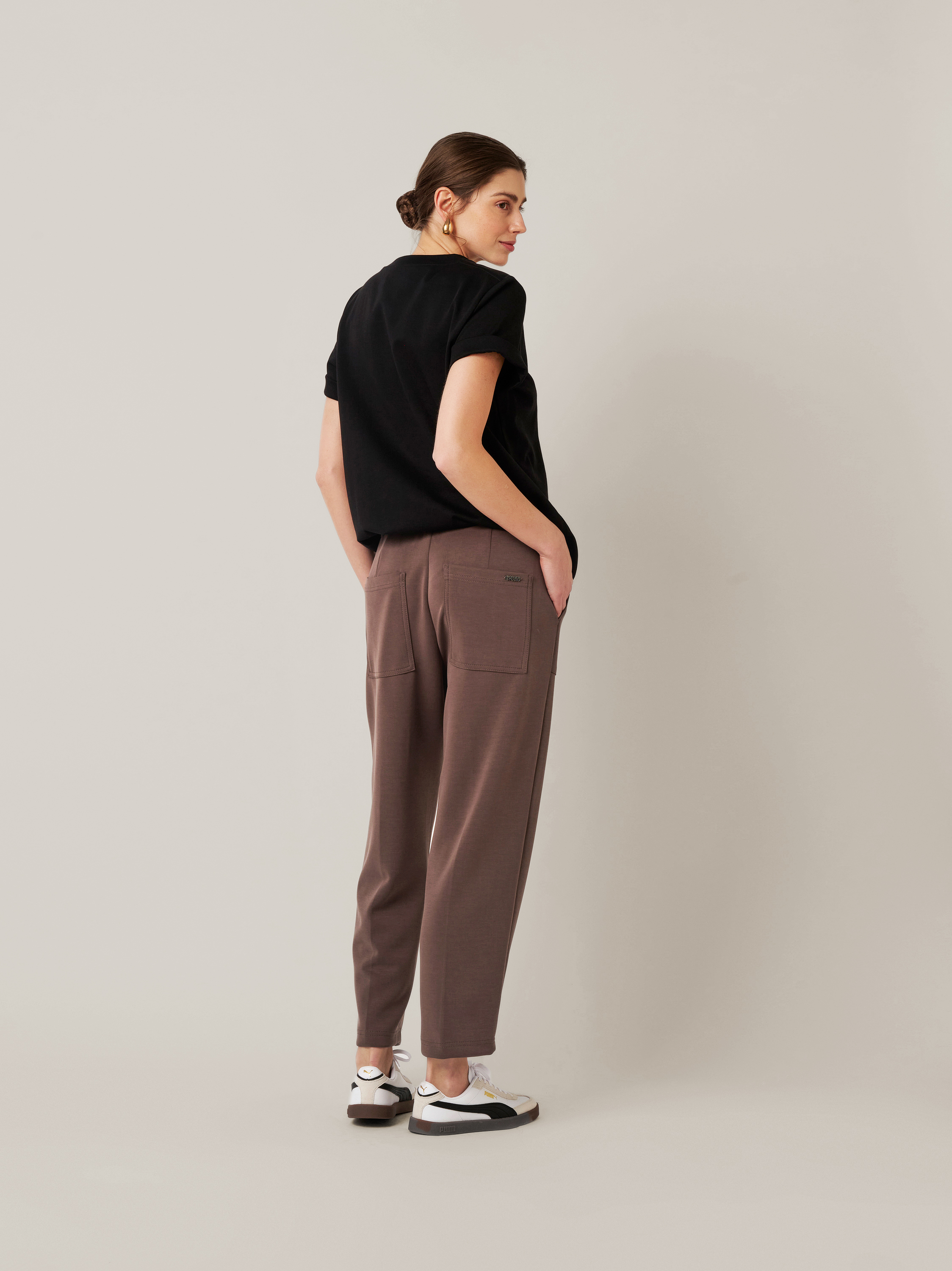 Womens trousers Mara Tapered in brown, tapered-fit trousers made of scuba, back view worn by model