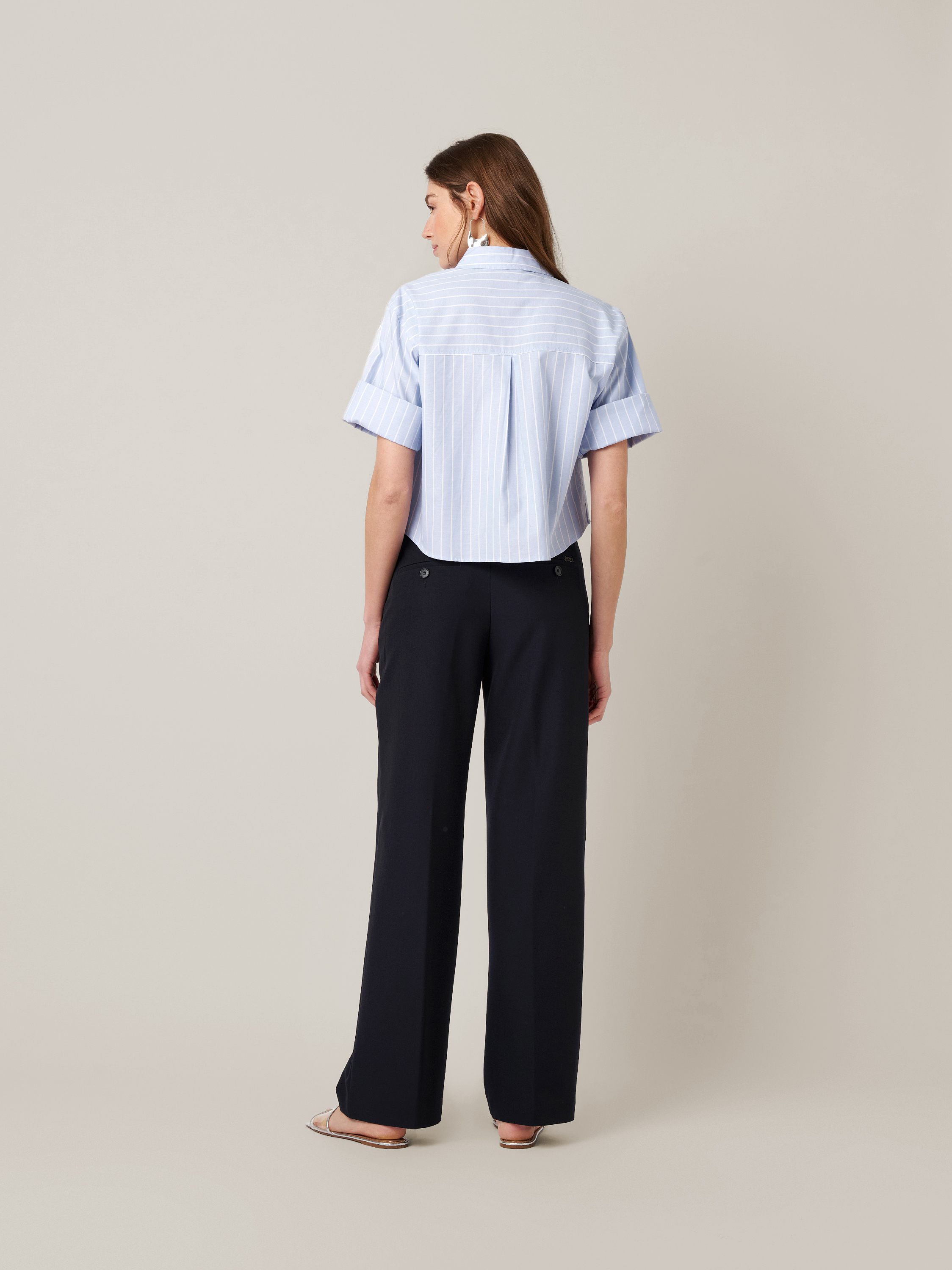 Womens trousers Audrey Wide in navy, fluid crepe trousers with front pockets, back view worn by model