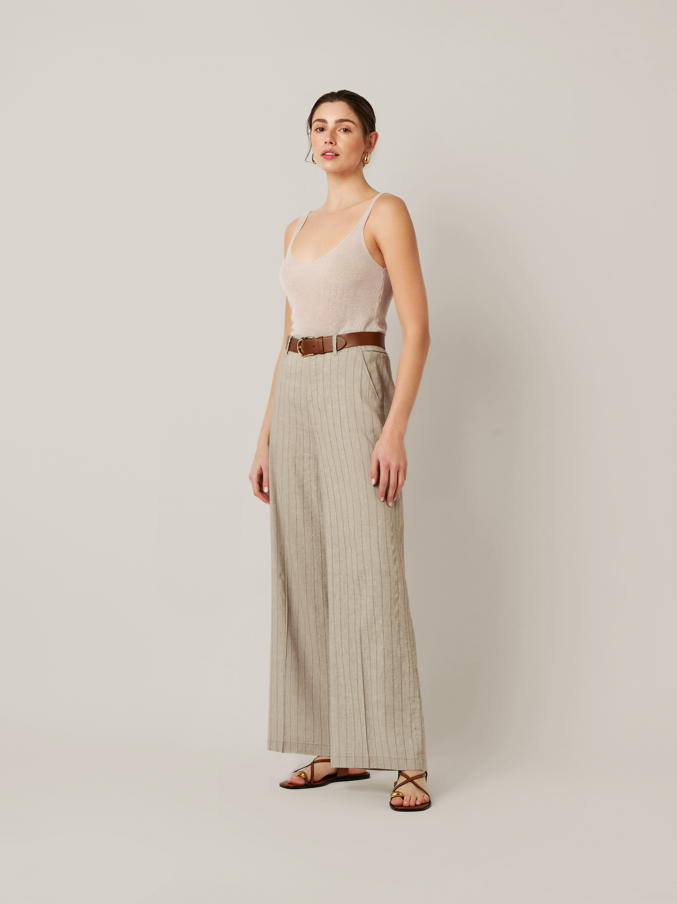 Womens trousers Mara Wide in khaki / gold, linen trousers with subtly shimmering stripes, outfit view worn by model