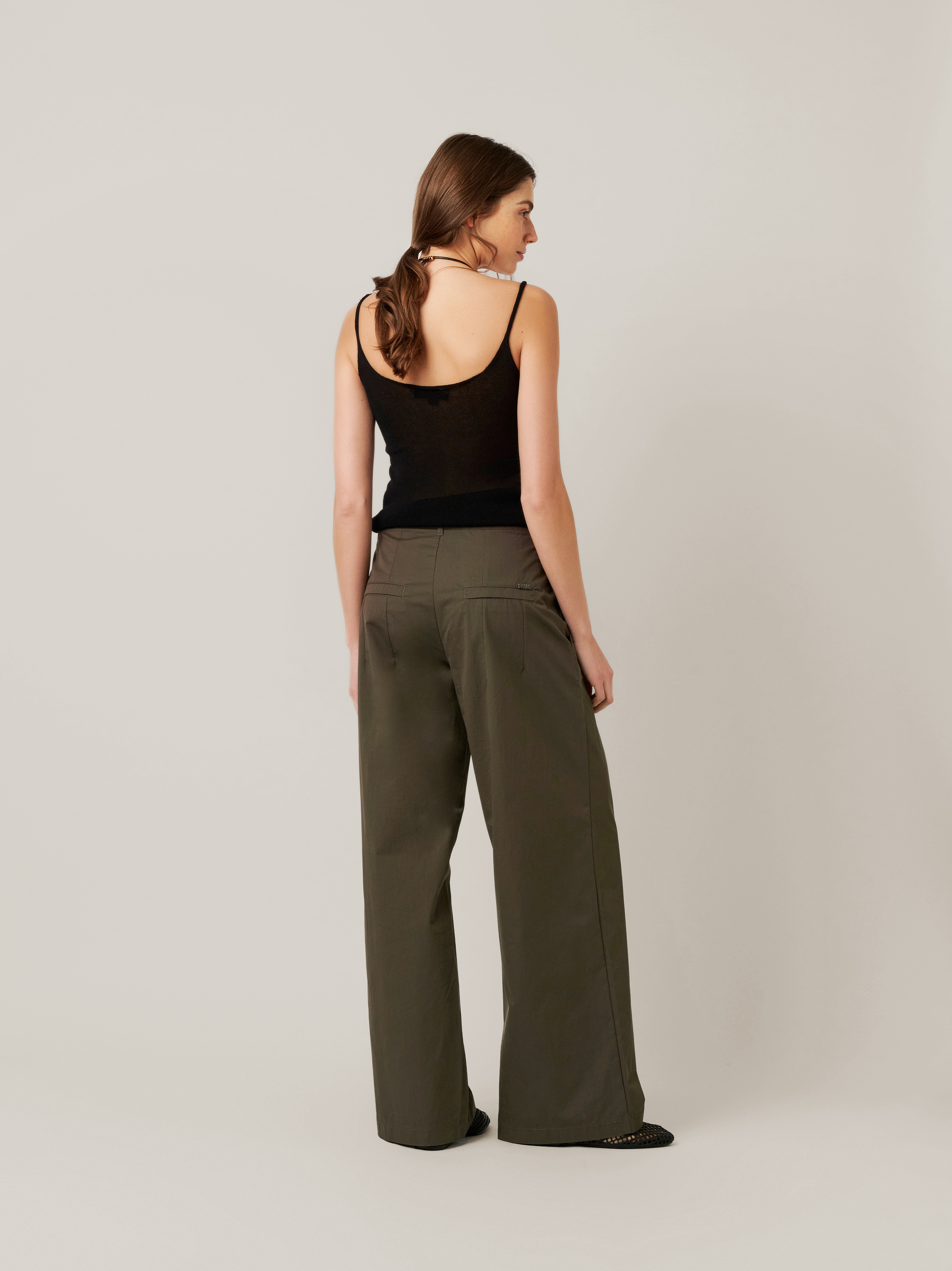 Womens trousers Mara Wide in khaki, wide-leg trousers made of papertouch cotton, back view worn by model